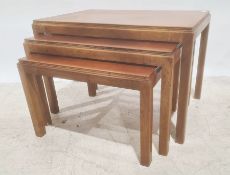 Nest of three teak Gordon Russell rectangular coffee tables on square section supports