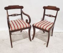 Set of eight (six plus two carvers) Regency mahogany dining chairs, carved top rails, and reeded