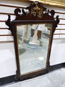 19th century wall mirror with fretwork carved frame surmounted by ho-ho bird, rectangular plate
