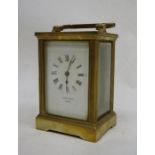 Brass and glass-cased carriage clock marked 'John Castle of London'
