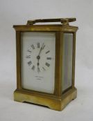 Brass and glass-cased carriage clock marked 'John Castle of London'