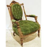 Late 19th century armchair, the shield-shaped back, seat and arms with green button-back upholstery,