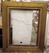 Gilt painted wood picture frame with stylised flowerhead and ropetwist decoration, 111cm x 91cm