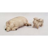 Cream painted cast iron pig money box the pig lying down and another smaller, the pig with wings (2)