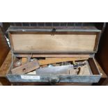 Wooden tool box containing various vintage hand tools