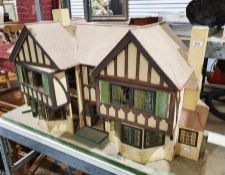 Wooden doll's houseCondition ReportWoodworm to the gables and other areas, thick layer of dust to