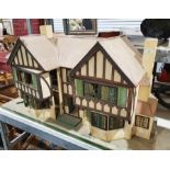 Wooden doll's houseCondition ReportWoodworm to the gables and other areas, thick layer of dust to