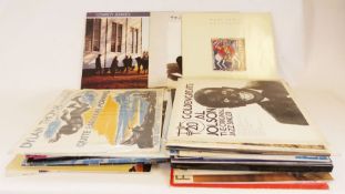Small collection of LP's to include Bob Marley Legends, Paul Simon Gracelands, etc. (1 box)