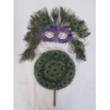 Peacock feather mask, a peacock feather circular fan and an Oriental silk feather and painted fan