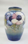 Moorcroft pottery vase, baluster form, light blue ground, anemone pattern, marked to base, with