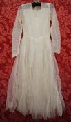 1950's machine lace and net wedding dress with its satin and lace fitted bodice, pearl and loop