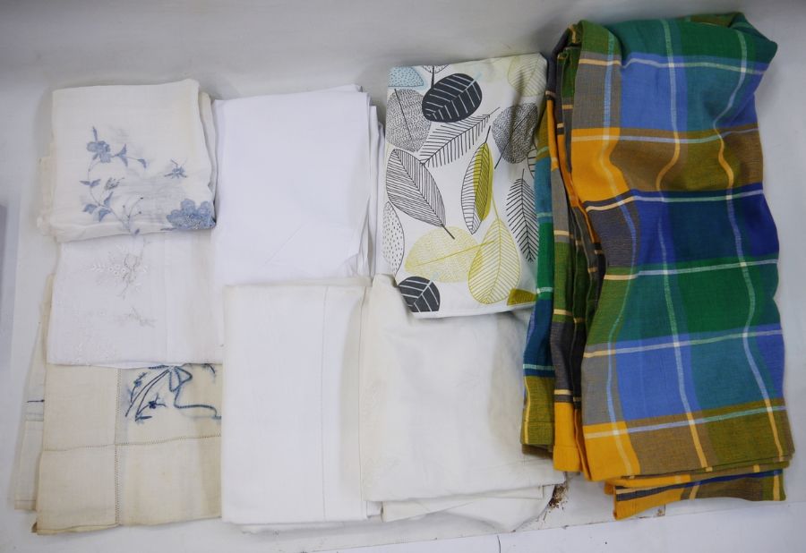 Assorted damask and other table linen and a circular wipe down tablecloth of Orla Kiely style design