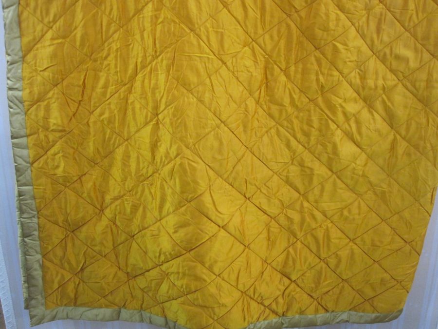 Superking gold-coloured quilted bedspread, a superking green quilted velvet bedcover trimmed with