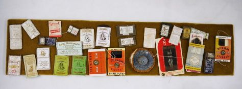 Quantity of mounted paper needle packets and a hat needle case