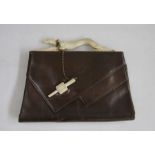 Brown leather vintage bag, the fixed bakelite handle formed as a running greyhound, the bakelite