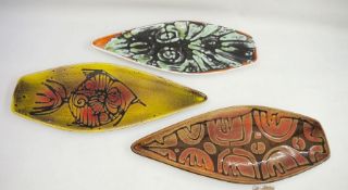 Three Poole pottery Delphis shaped dishes, shape no. 82, each 42cm long approx.