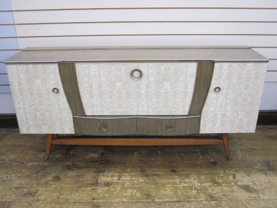 Mid 20th century melamine sideboard with full front flanked by pair of cupboards and two drawers