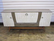 Mid 20th century melamine sideboard with full front flanked by pair of cupboards and two drawers