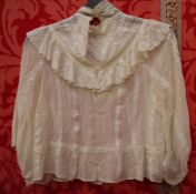 Edwardian lace and silk blouse with high neck, the cuffs have been cut off the sleeves, a late