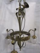 Arts & Crafts hammered brass three-branch electrolier with three cut glass shades (later