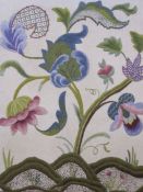 20th century crewelwork  of flowering plant, in purples and greens, 60cm x 52cm and an crewelwork