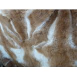 Guanaco (llama) fur throw backed by gold-coloured satin, labelled 'Hockley', 231cm x 241cm and two