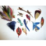 Quantity of assorted feathers, hats and hair decorations, to include bird brooches made of the