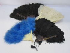 Tortoiseshell and ostrich feather fan, a faux tortoiseshell and feather fan, a plastic and blue