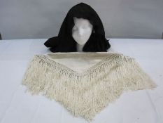 Cream Chinese style satin shawl with deep fringe, a black machine lace shawl and a large quantity of