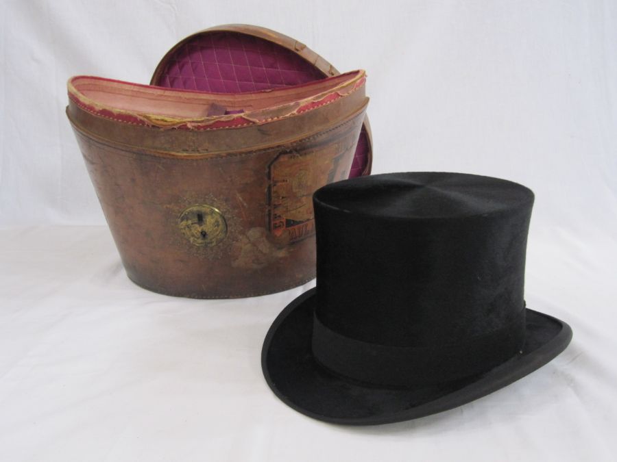 Black top hat within its original leather case, marked 'Lincoln Bennett & Co', the leather case