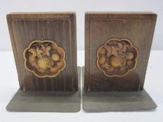 Pair Arts and Crafts carved wooden and engraved metal bookends, each with stylised fruit carved