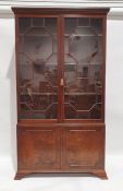 19th century mahogany bookcase, the moulded cornice above the astragal glazed doors enclosing