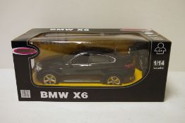 Boxed Jamara 1/14 scale radio controlled car, BMW X6 in black, including original fittings,