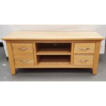 20th century oak coffee table, the rectangular top above drawers and over shelved undertier and an