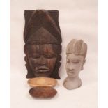 African carved hardwood mask depicting a woman with chip carved headdress, 48cm high, a carved