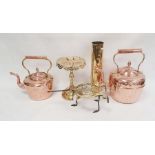 Two copper kettles, a brass trivet with royal cypher, a set of five graduated copper saucepans