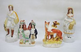 Four 19th century Staffordshire flatback pottery models, one of fox as a spill vase, another of