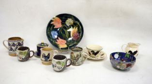 Nicholas Mosse pottery cream jug and one further, a Bridgewater teacup, saucer and cream jug, a