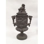 Bronze two-handled urn decorated with a continuous band of cherubs in a Bacchanalian scene, the