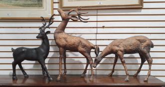 Two copper-effect metal models of deer and another resin model of a deer, tallest 52cm high (3)