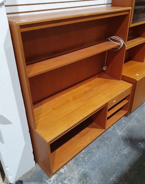 Mid century modern teak lounge unit with assorted shelves and drawer, on plinth base, 130cm x 140cm