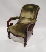 Late Victorian armchair with overscrolled arms, on turned front legs to brass castors, green