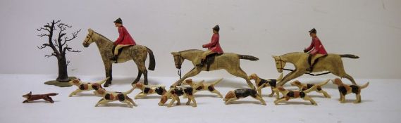 Vintage wooden models of huntsmen and hounds to include, horses, hounds, riders and foliage (1