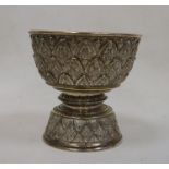 Late 19th century Indian white metal pedestal bowl of circular form with stylised geometric leaf