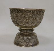 Late 19th century Indian white metal pedestal bowl of circular form with stylised geometric leaf