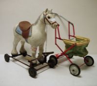 Tri-ang ride along horse and a doll's pram (2)