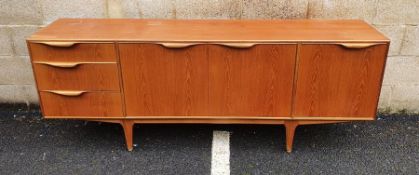 Mid century modern McIntosh teak sideboard with assorted drawers and cupboard doors, on tapering