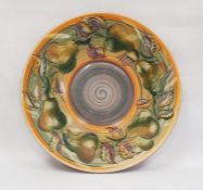 Large Jersey pottery charger with hand painted pear and leaf decoration