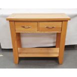 20th century oak hall table, the rectangular top above two drawers over shelved undertier, W 85cm