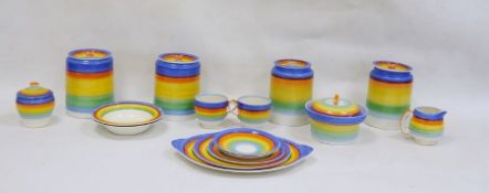 Gray's pottery part table and kitchenware decorated in blues, oranges, yellows and greens to include